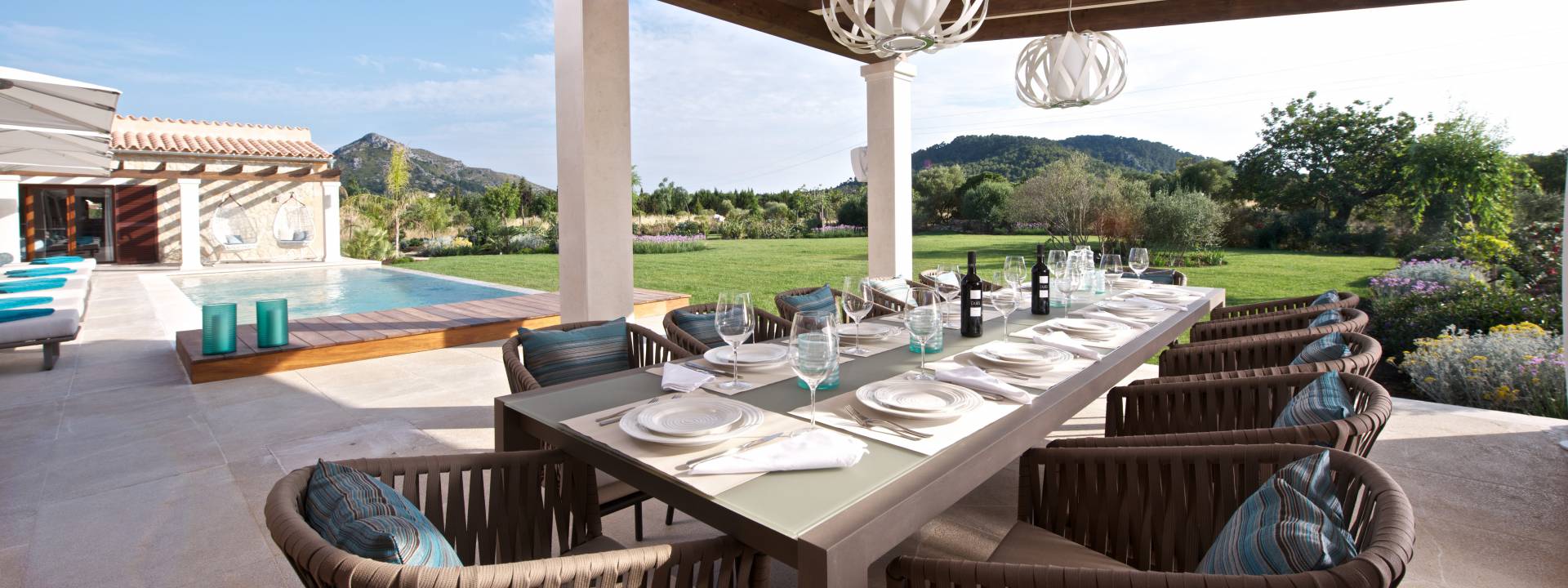 Contemporary country-house. Dining table in the garden.